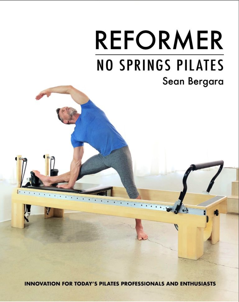 Sean Bergard stretching to the side on a reformer